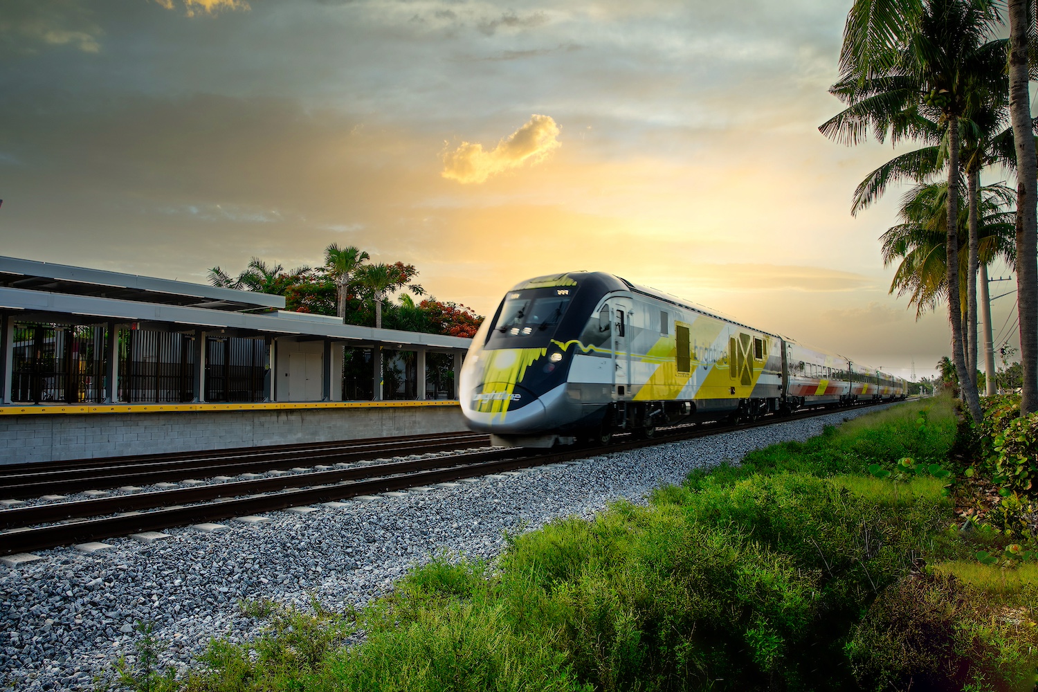 A Brightline train on the tracks. 
