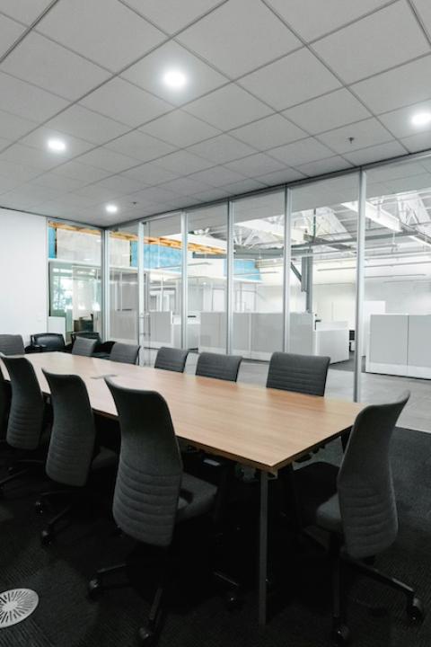 An empty boardroom table — CSR