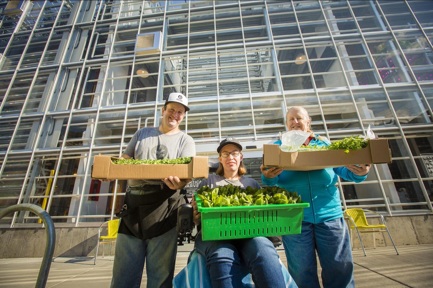 Vertical Harvest Employees in front of greenhouse — vertical farming 